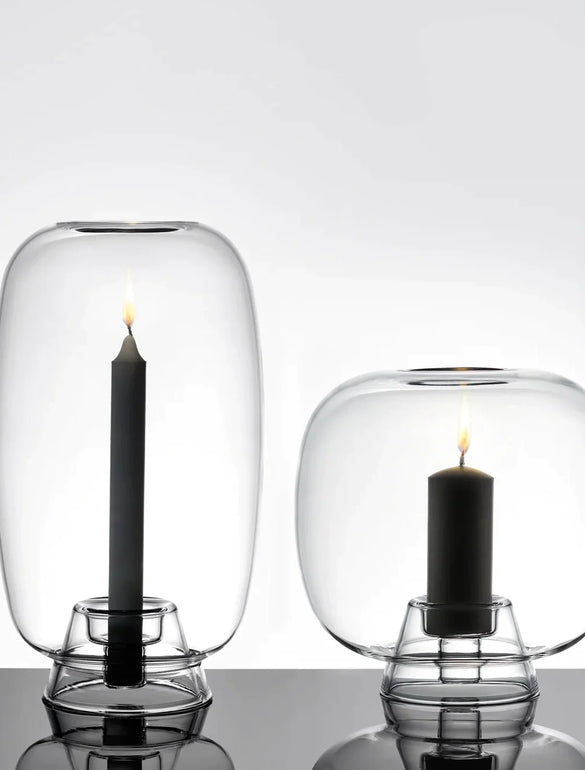 Candele nere in campane di vetro